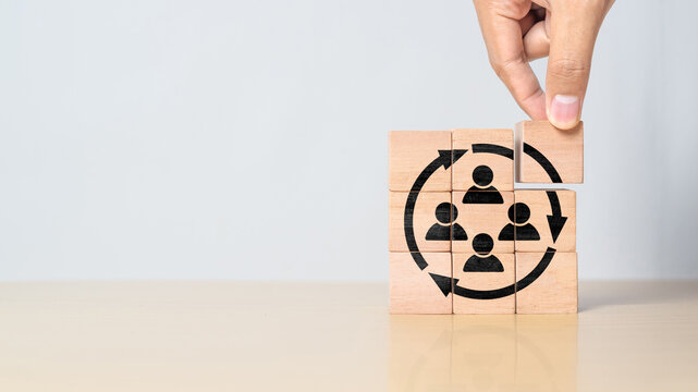 Manpower planning and management concept. Forecasting future staffing needs, analyzing current staffing levels and developing human resource strategies. Wooden blocks with manpower or staffs icons