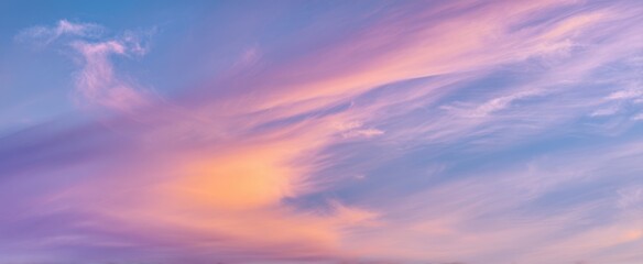 Fototapeta premium The beautiful gradient sky adorned with pastel-colored clouds at sunset