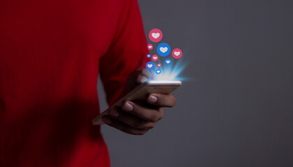 Like Social Media Concept, Man using smart phone mobile with, Social Media, on soft blurred background