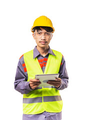 Confident architect man wearing yellow vests and helmet using tablet computer standing isolated on white background.