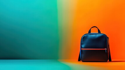Stylish black backpack with orange zipper against a vibrant gradient background