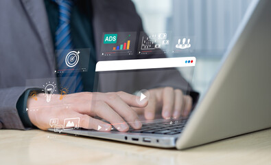 Online education or distance learning concept using wireless Internet technology. Businessman use hands to touch a virtual computer screen, studying or studying innovation learning of business course.