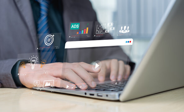 Online education or distance learning concept using wireless Internet technology. Businessman use hands to touch a virtual computer screen, studying or studying innovation learning of business course.