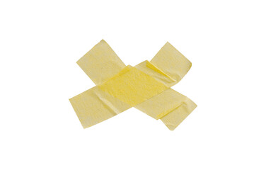 Yellow painter's tape isolated on white background, macro. Torn, crumpled, twisted strips of yellow painter's tape on white background, close-up.
