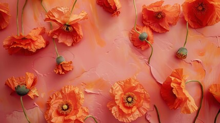 Top view of vibrant orange poppies arranged on a soft coral table featuring soft patterned lines, adding depth and interest to the floral arrangement.