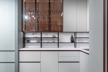 large modern built-in kitchen with lots of upper and lower cabinets, drawers and shelves. light...