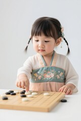 there is a little girl playing a game of go on a table