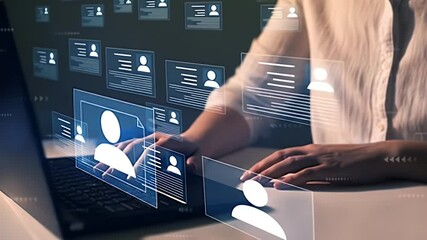 Woman Typing On Laptop Near Digital Resume Screen With Blue Accents In Dim Room for Human Resources And Recruitment Concept