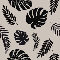 Seamless pattern with black tropical leaves on a beige background. Elegant botanical design.