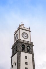 Historic Clock Tower of Igreja de Sao Sebastiao in Ponta Delgada, Sao Miguel, Azores. Portuguese architecture, volcanic stone, Atlantic island landmark
