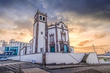 Historic Igreja de Sao Pedro with Bell Tower and Port View in Ponta Delgada. Azorean church,...