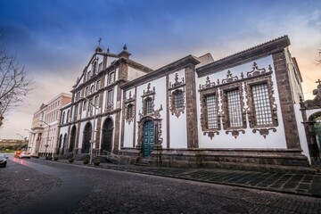 Fototapeta premium Impressive Igreja de Sao Jose Standing Prominently in Ponta Delgada Cityscape. Azorean religious landmark, grand urban architecture, historic downtown, island heritage. Sao Miguel, Portugal