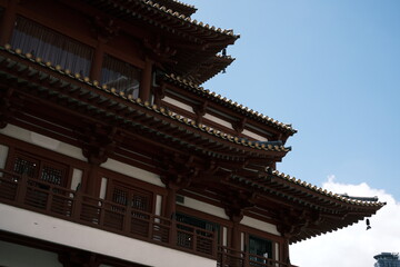 A building with a lot of wood and a lot of windows