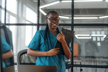 In the office clinic. Female doctor in coat