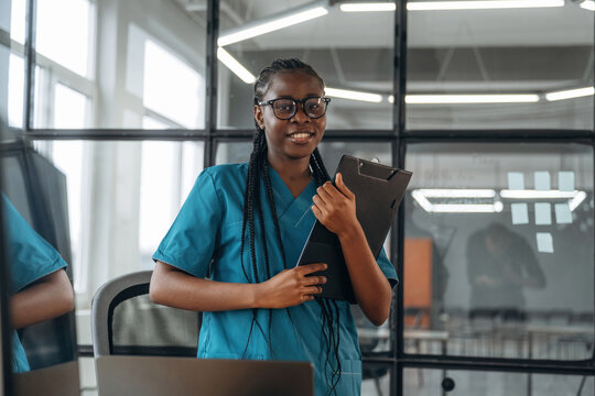 In the office clinic. Female doctor in coat