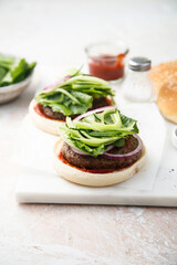 Homemade beef burger with cucumber salad