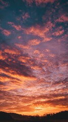 Golden sunset over a serene landscape, warm light through clouds, orange and purple hues blending in harmony