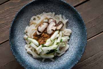 fried ground soy bean with fresh shiitake mushroom and sliced cucumber also known as Zhajiangmian