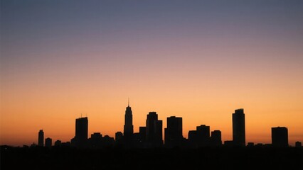 City skyline silhouette against a warm dusk sky, urban simplicity meets serene twilight.