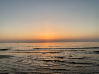 Golden sunrise over the calm sea of Pineto, a beautiful coastal town in Abruzzo, Italy, creating a peaceful and scenic view