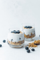 Yogurt granola parfaits topped with fresh blueberries