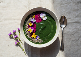 Colorful Smoothie Bowl with Spirulina and Edible Flowers – Artistic Top View