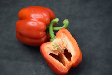 fresh red pepper with black background