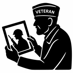 Veteran holding photo of soldier in military uniform for Veterans Day  