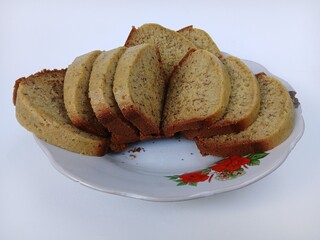 A plate of banana cake, a traditional Indonesian cake made from bananas as the main ingredient, has a soft texture and sweet taste