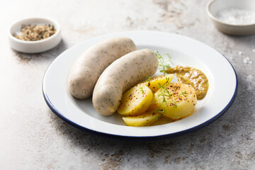 White sausages with potato salad and mustard