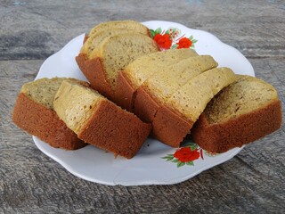A plate of banana cake, a traditional Indonesian cake made from bananas as the main ingredient, has a soft texture and sweet taste
