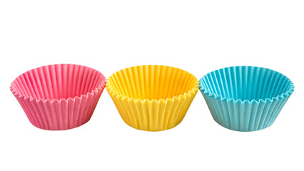 Colorful cupcake liners: pink, yellow, and blue baking cups on transparent background
