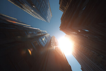 Looking up at buildings, feeling awe as sun shines, highlighting architecture