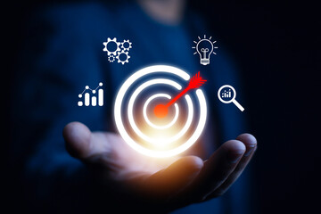 Businessman showing virtual target icon for business purpose, strategic planning for business growth and target customer group. Set business objectives goals, value, growth.	
