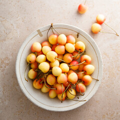 Pink cherry in a bowl