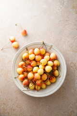 Pink cherry in a bowl