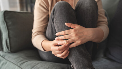 Woman takes off an wedding ring