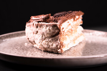 Plate with a piece of delicious homemade chocolate cake on the table. Chocolate cupcake. Dessert. Food