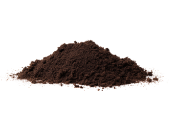 A pile of dark brown soil against a black background in a studio setting with soft lighting effects