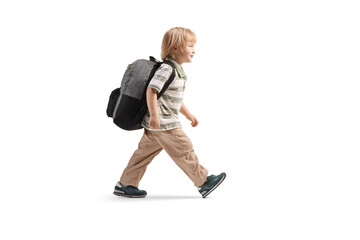 Preschool boy with a backpack walking