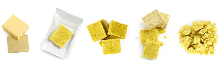 Set with bouillon cubes on white background, top view. Whole and crumbled