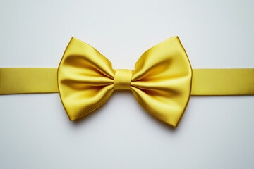 Bright yellow bow tie with a satin finish, perfectly tied, centred on a clean white background