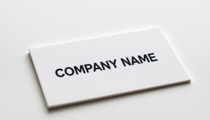 Closeup of business card featuring logo and text on white background, conveying professionalism and branding