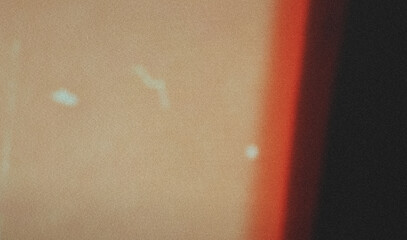 Imitation old analog film effect. Colorful light on black. Grain texture