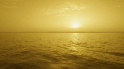 Fototapeta premium Golden sunset over a tranquil sea.