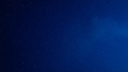Starry night sky. Dark night blue sky with stars. Galaxy space. Glowing stars. New Year, Christmas and Celebration background concepts