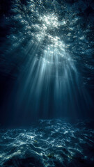 Sunlight piercing through the ocean's surface, creating shimmering light shafts in the deep blue water. Serene underwater scene.