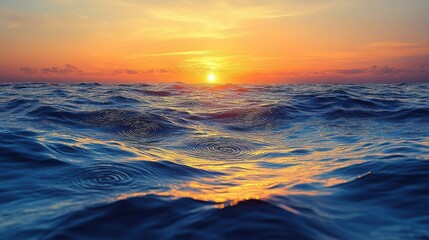 Obraz premium Vibrant Sunset Reflection on Ocean Waves with Orange Sky and Horizon