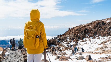 Tourist admiring rock formations in the Teide, Teide National Park, Tenerife, Canary Islands, Spain