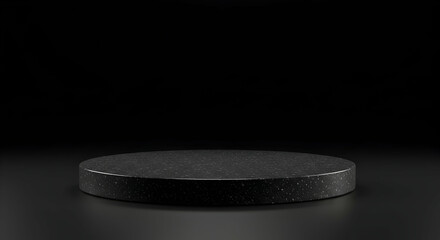 Round black stone display podium with dark background